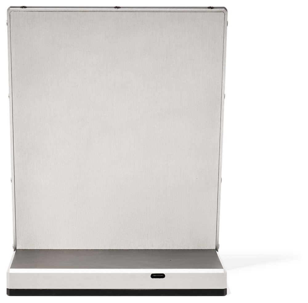 The anodised aluminium back of the Newsboard: an even, natural-silver matte surface with a single USB-C port at the base.