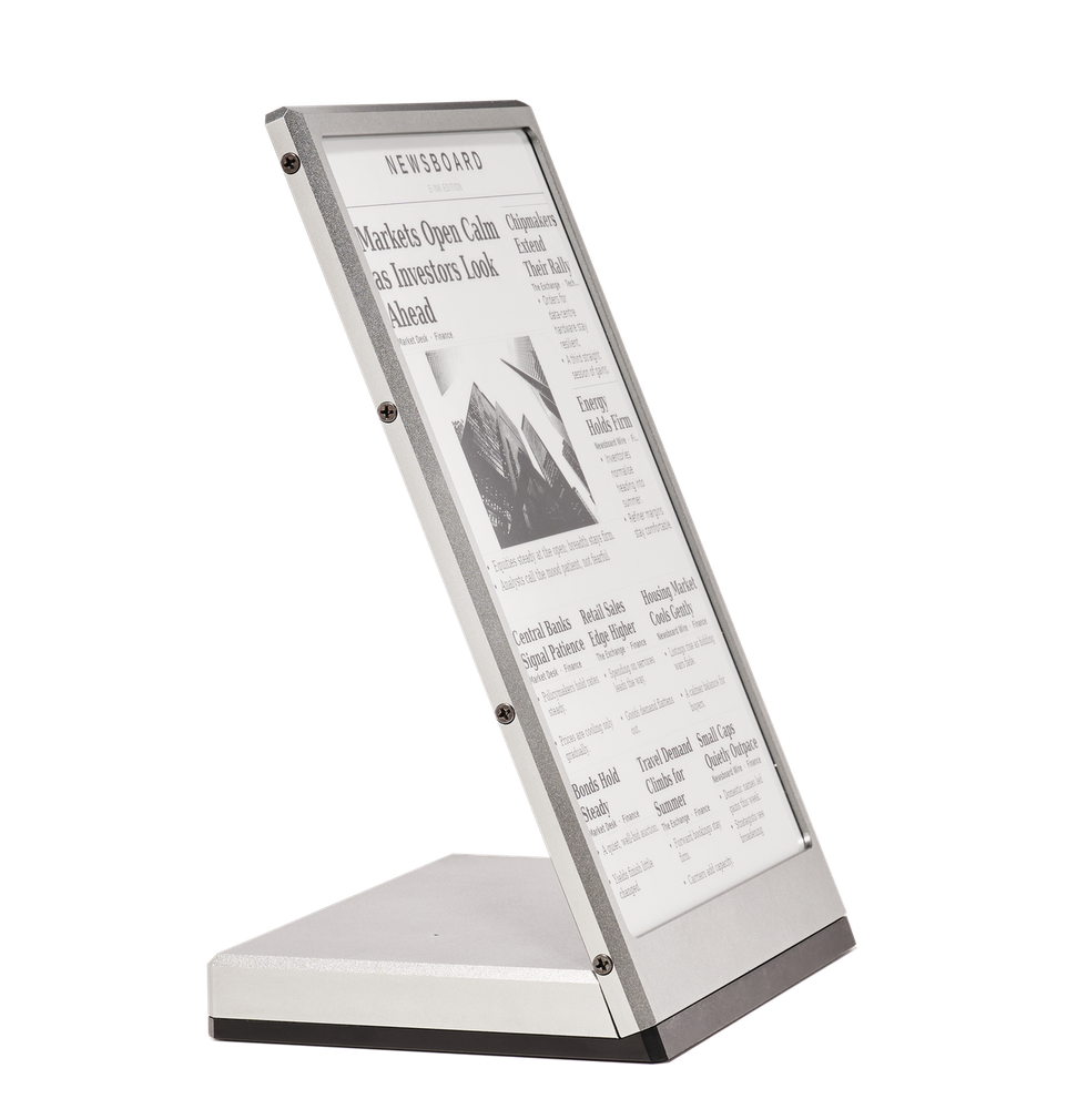 Newsboard turned to three-quarters, the page still legible from the side.
